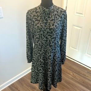 Long sleeve black & white dress with long sleeves.  Polyester material